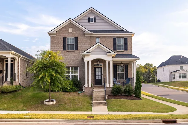 a front view of a house with a yard