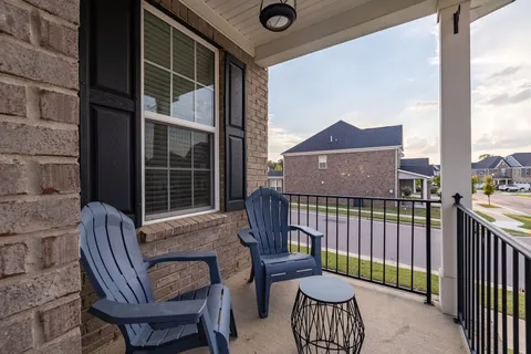 a view of a chair and table in the balcony
