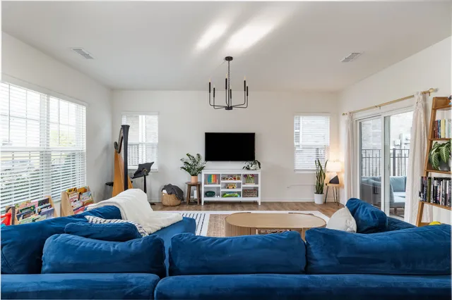 a living room with furniture or couch and a flat screen tv
