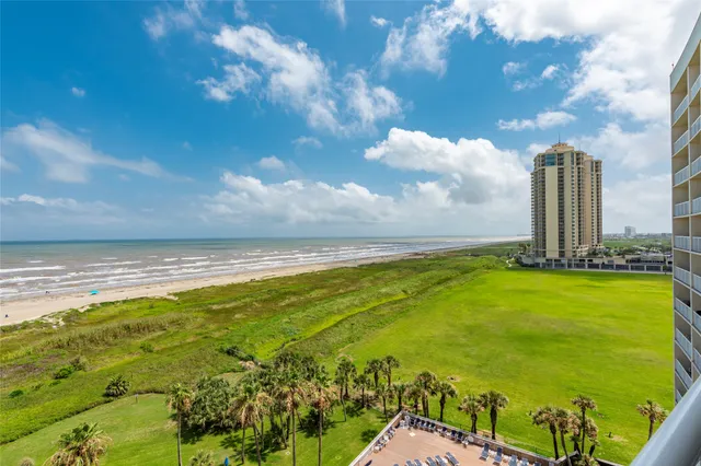 a view of a balcony with an ocean view