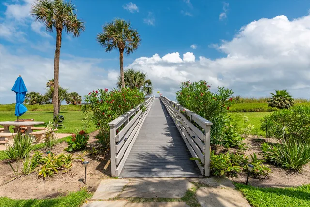 a view of a backyard with sitting area