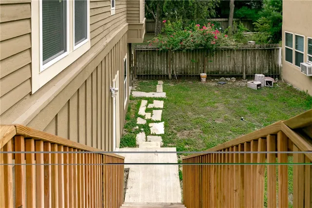 a view of a wooden fence and a bench in the porch