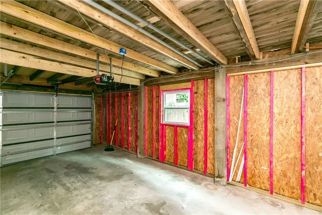 a view of a room with wooden walls and stairs