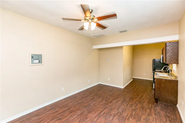 a view of a livingroom with wooden floor