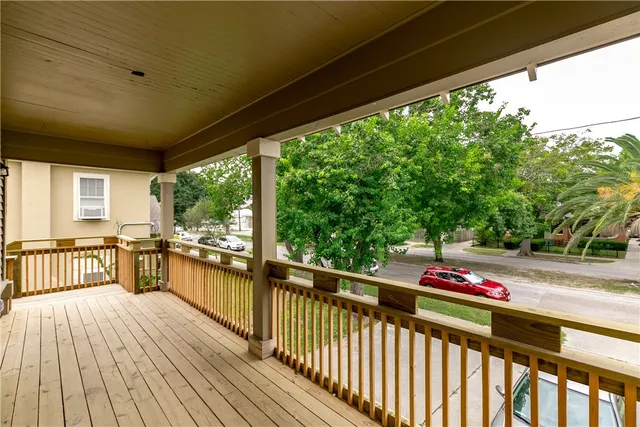 a front view of a house with a yard and a garage