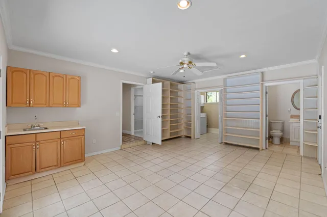a view of a kitchen with cabinet dryer and windows