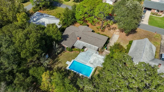 an aerial view of a house with outdoor space and street view