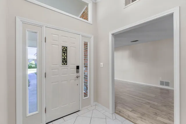 wooden floor with white walls