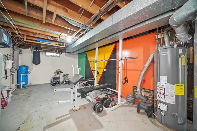 a view of storage and utility room with windows