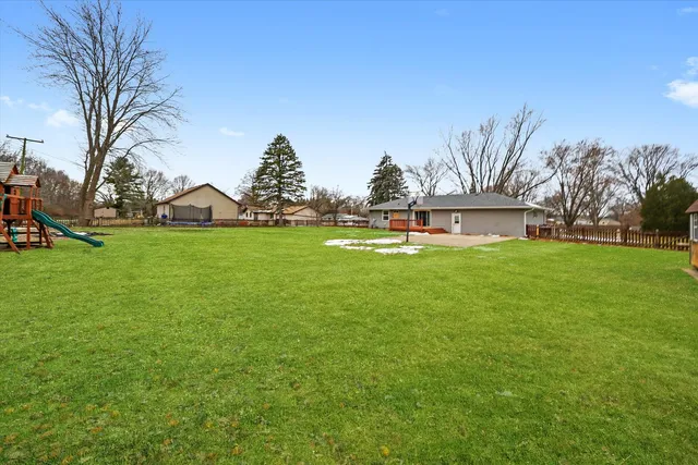 a swimming pool with trees in the background