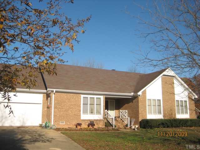 3908 Littlefield Court Raleigh, NC 27606 - Photo 1 of 25 EXTERIOR VIEW OF THIS ALL BRICK HOME ACCENTED BY CEDAR SIDING IN FRONT.