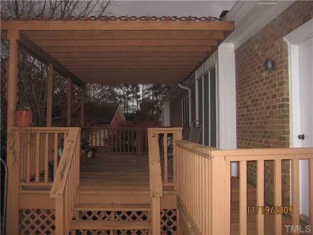 3908 Littlefield Court Raleigh, NC 27606 - Photo 19 of 25 VIEW OF THE DECK FROM THE PATIO AREA