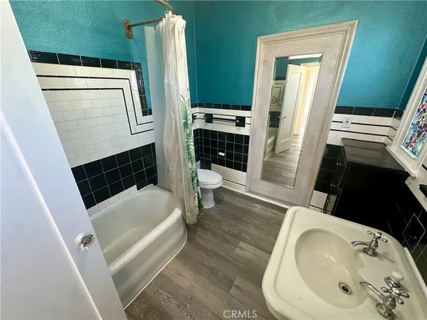a bathroom with a sink a toilet and a bathtub