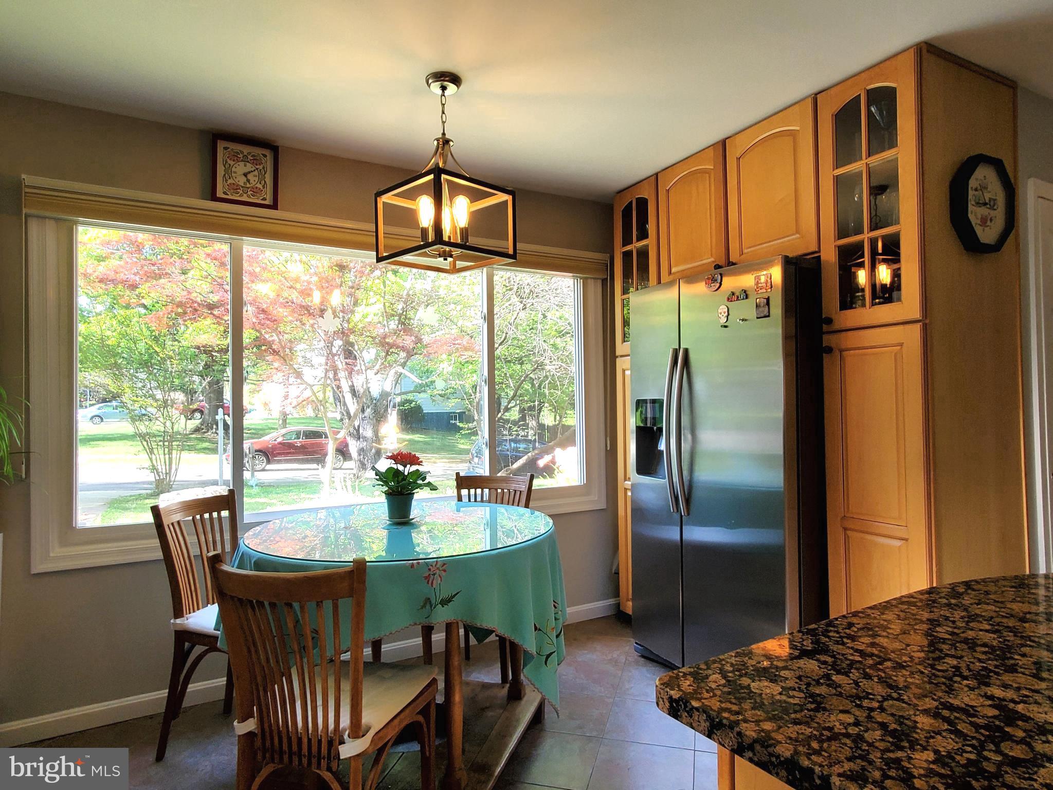 1516 Winding Waye Lane Silver Spring, MD 20902 - Photo 16 of 55 a view of a dining room with furniture window and outside view
