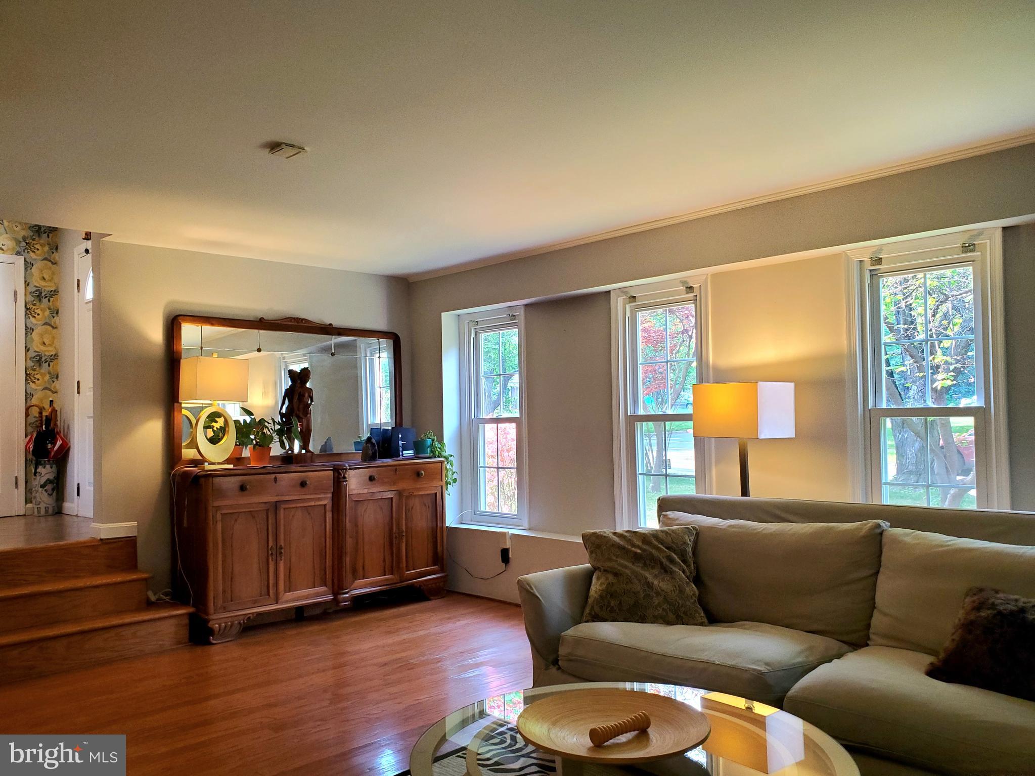1516 Winding Waye Lane Silver Spring, MD 20902 - Photo 21 of 55 a living room with furniture and a large window