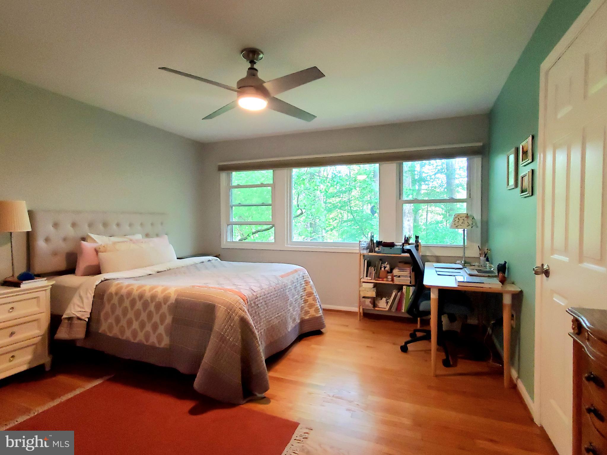 1516 Winding Waye Lane Silver Spring, MD 20902 - Photo 26 of 55 a bedroom with a bed and a table