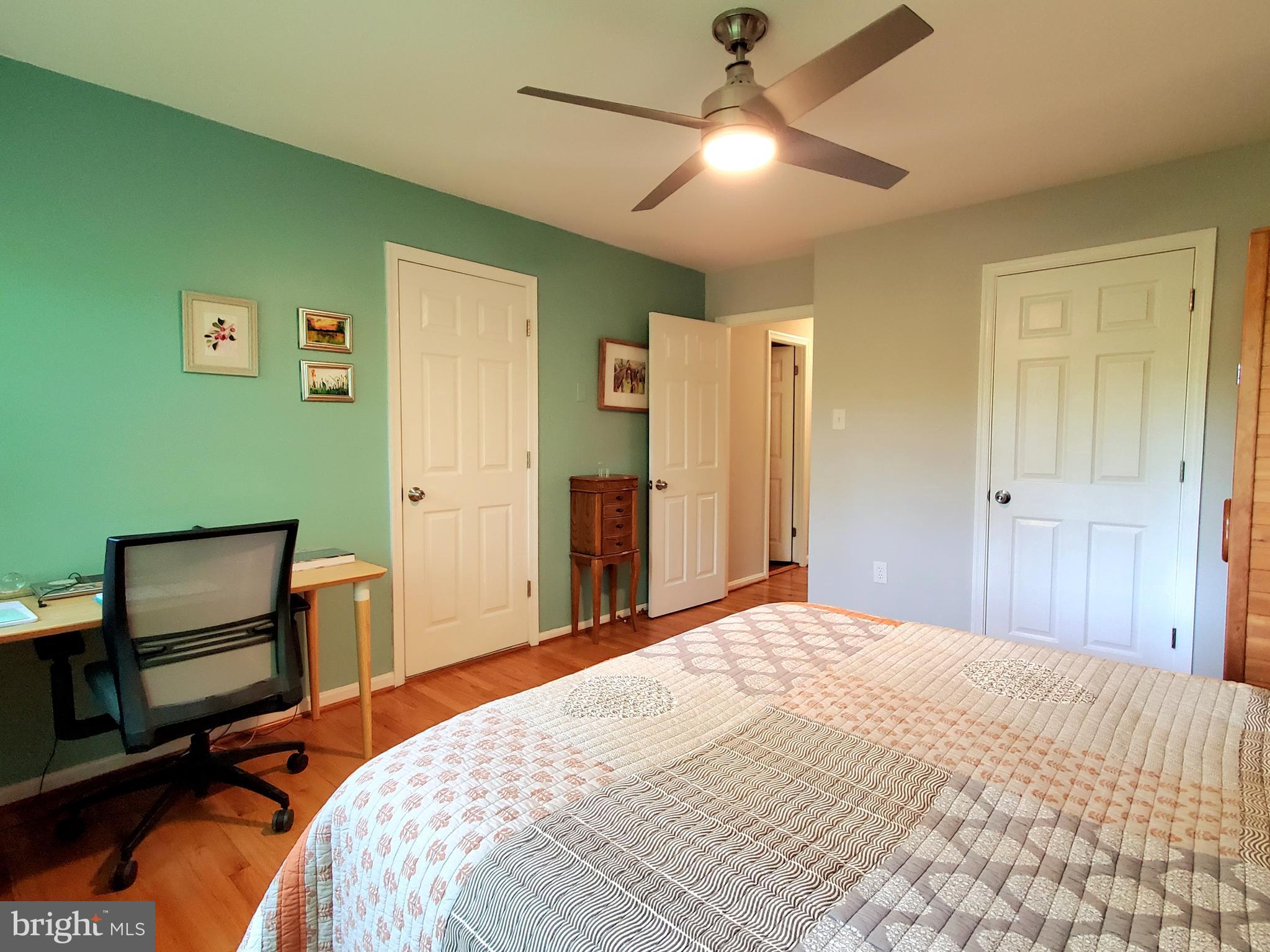 1516 Winding Waye Lane Silver Spring, MD 20902 - Photo 27 of 55 a bedroom with a bed and a chair