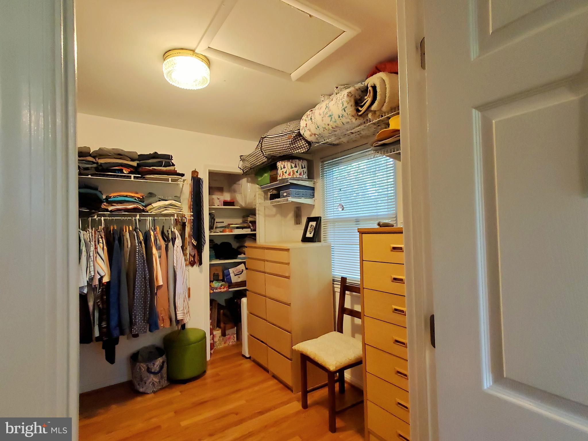 1516 Winding Waye Lane Silver Spring, MD 20902 - Photo 29 of 55 a view of walk in closet with clothes and shoes