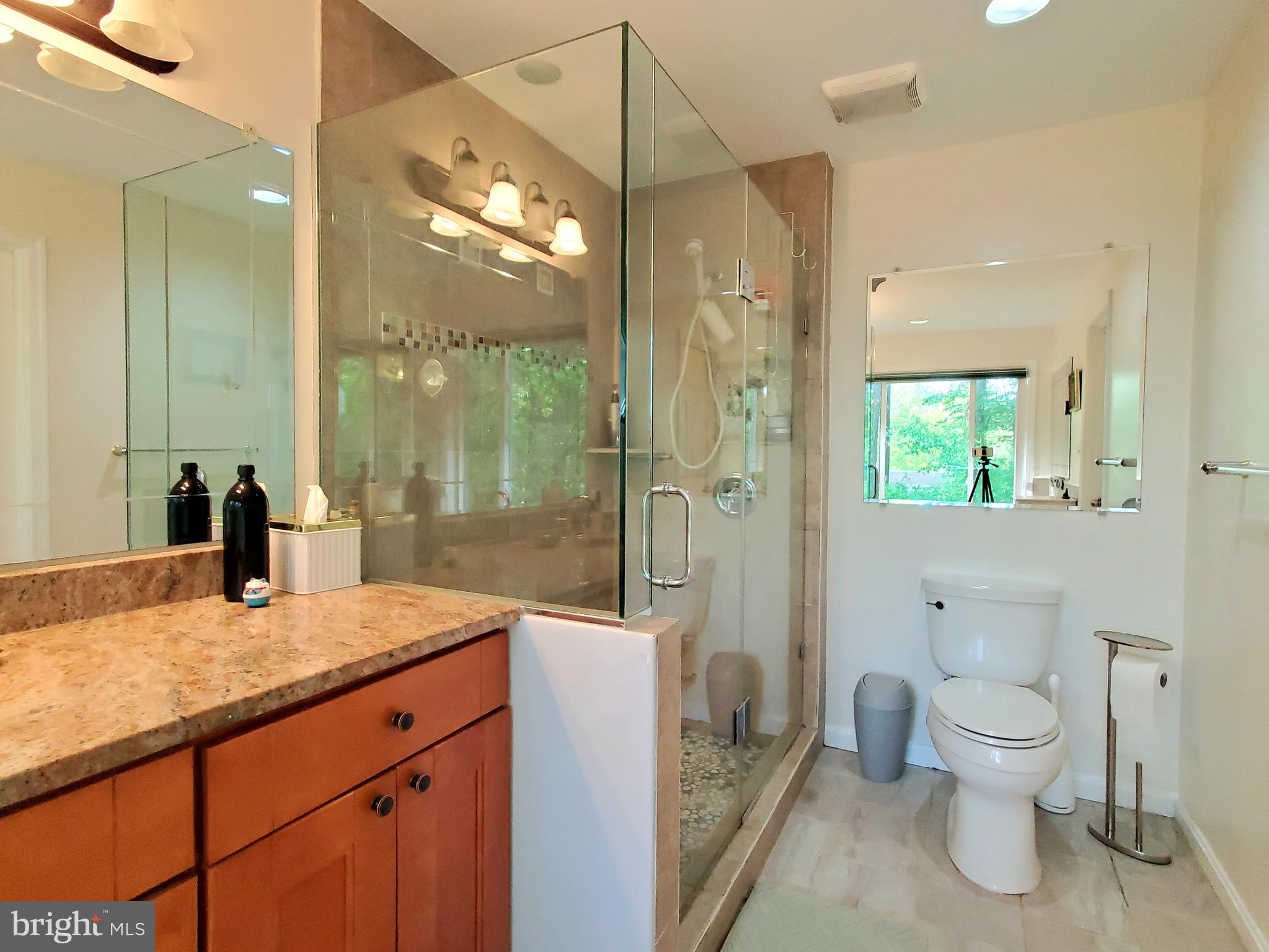 1516 Winding Waye Lane Silver Spring, MD 20902 - Photo 32 of 55 a bathroom with a granite countertop sink toilet and shower