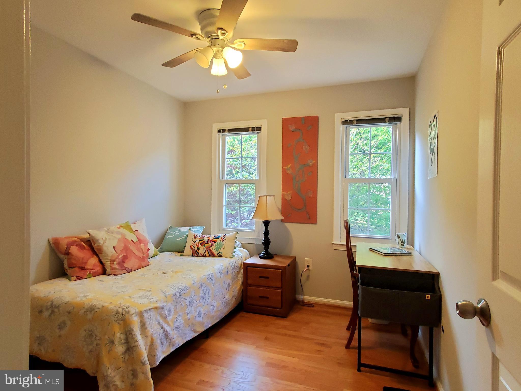 1516 Winding Waye Lane Silver Spring, MD 20902 - Photo 33 of 55 a bedroom with a bed and a window