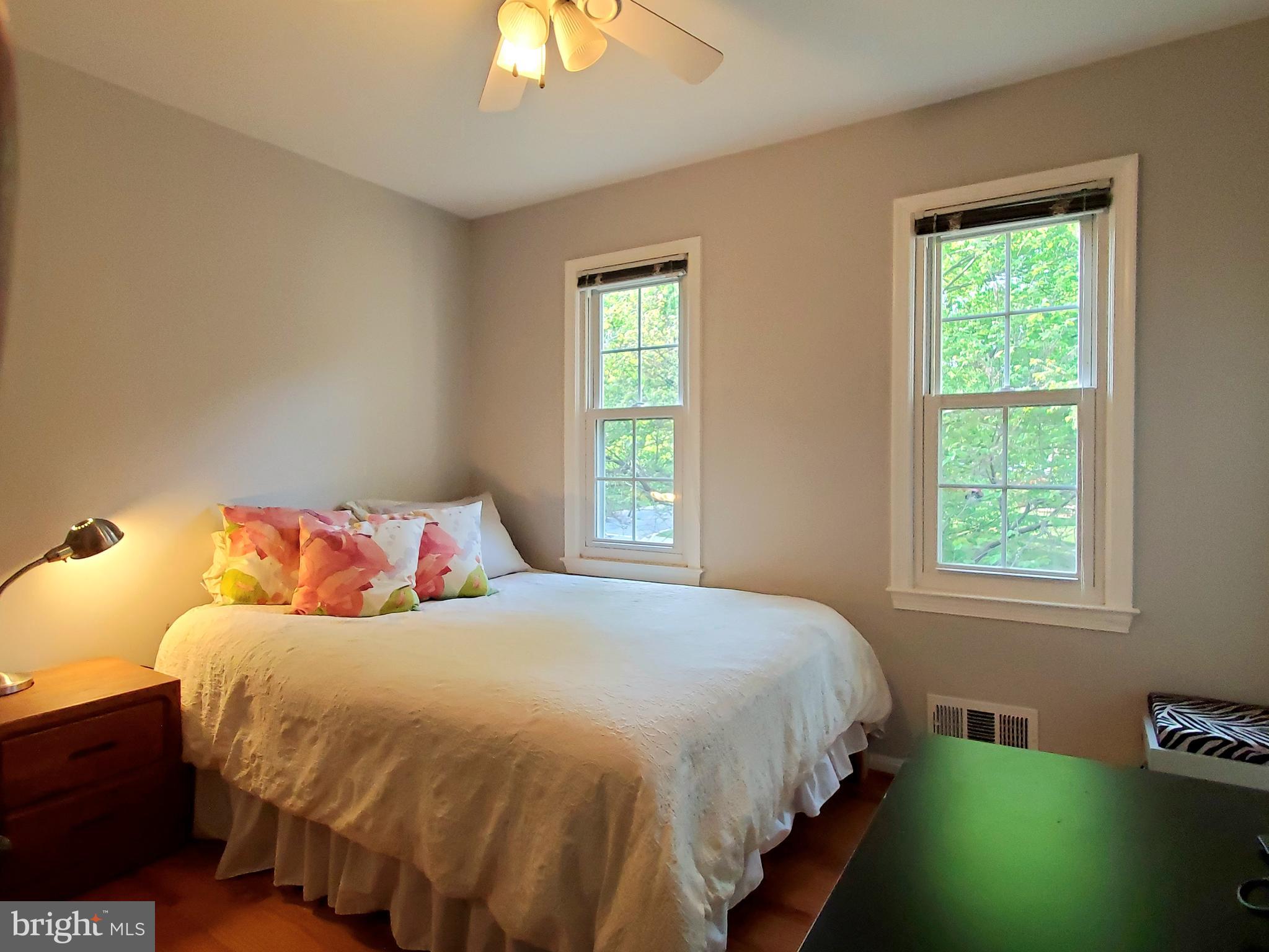 1516 Winding Waye Lane Silver Spring, MD 20902 - Photo 36 of 55 a bedroom with a bed and a window