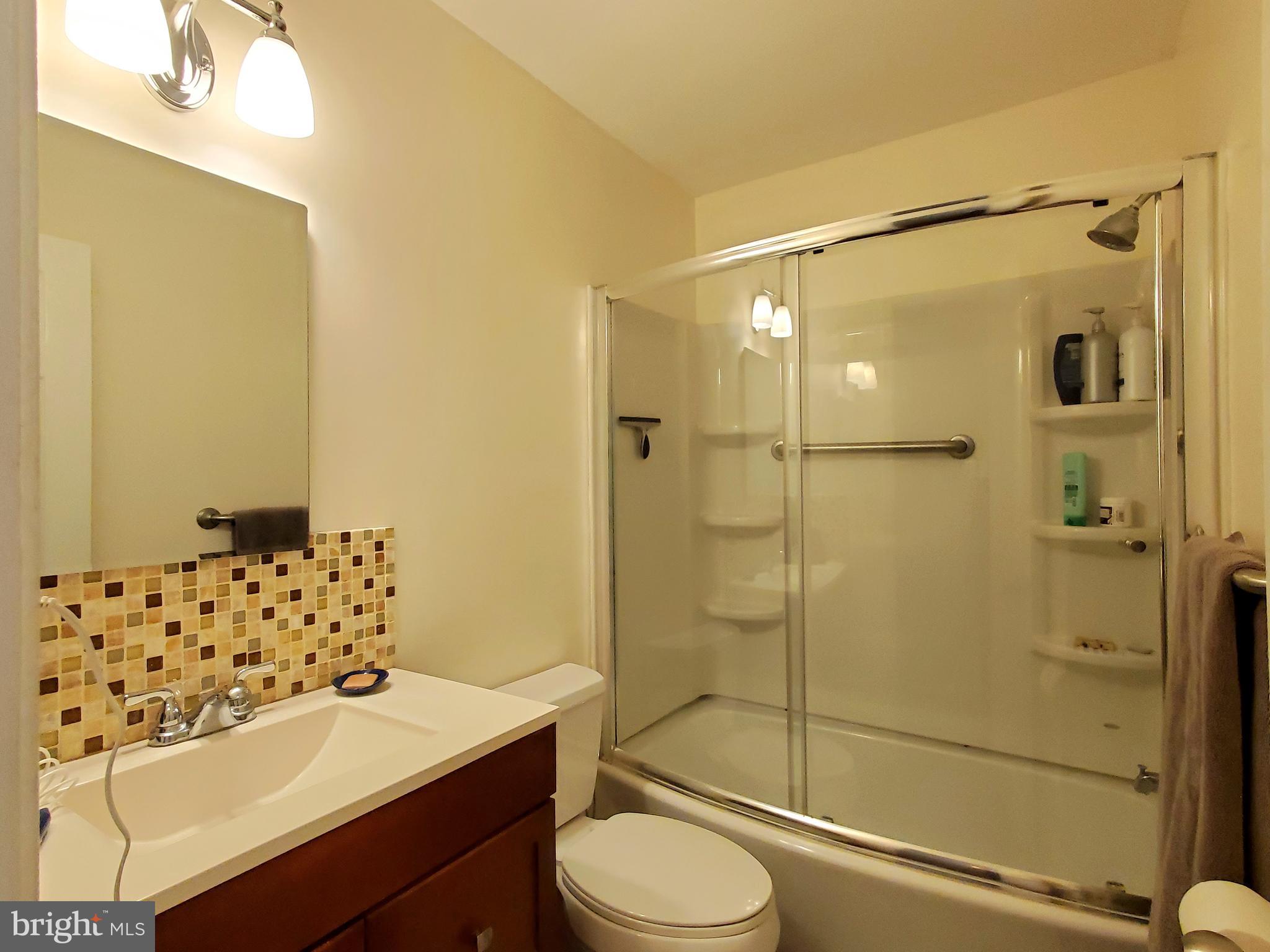 1516 Winding Waye Lane Silver Spring, MD 20902 - Photo 37 of 55 a bathroom with a sink toilet and shower