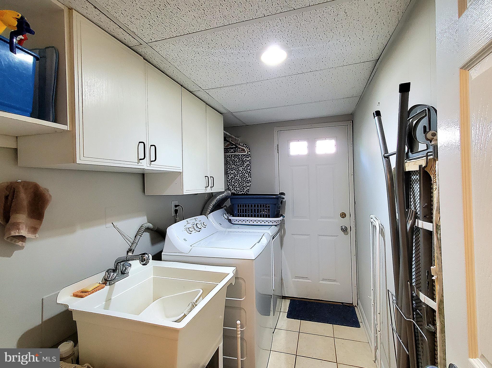1516 Winding Waye Lane Silver Spring, MD 20902 - Photo 39 of 55 a utility room with closet dryer and washer