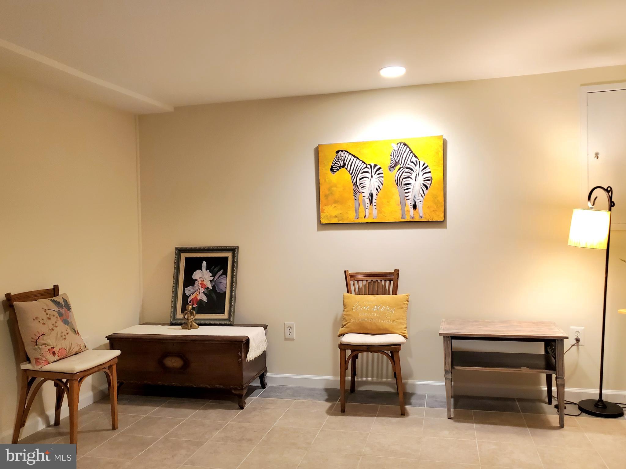 1516 Winding Waye Lane Silver Spring, MD 20902 - Photo 40 of 55 a living room with furniture and a rug
