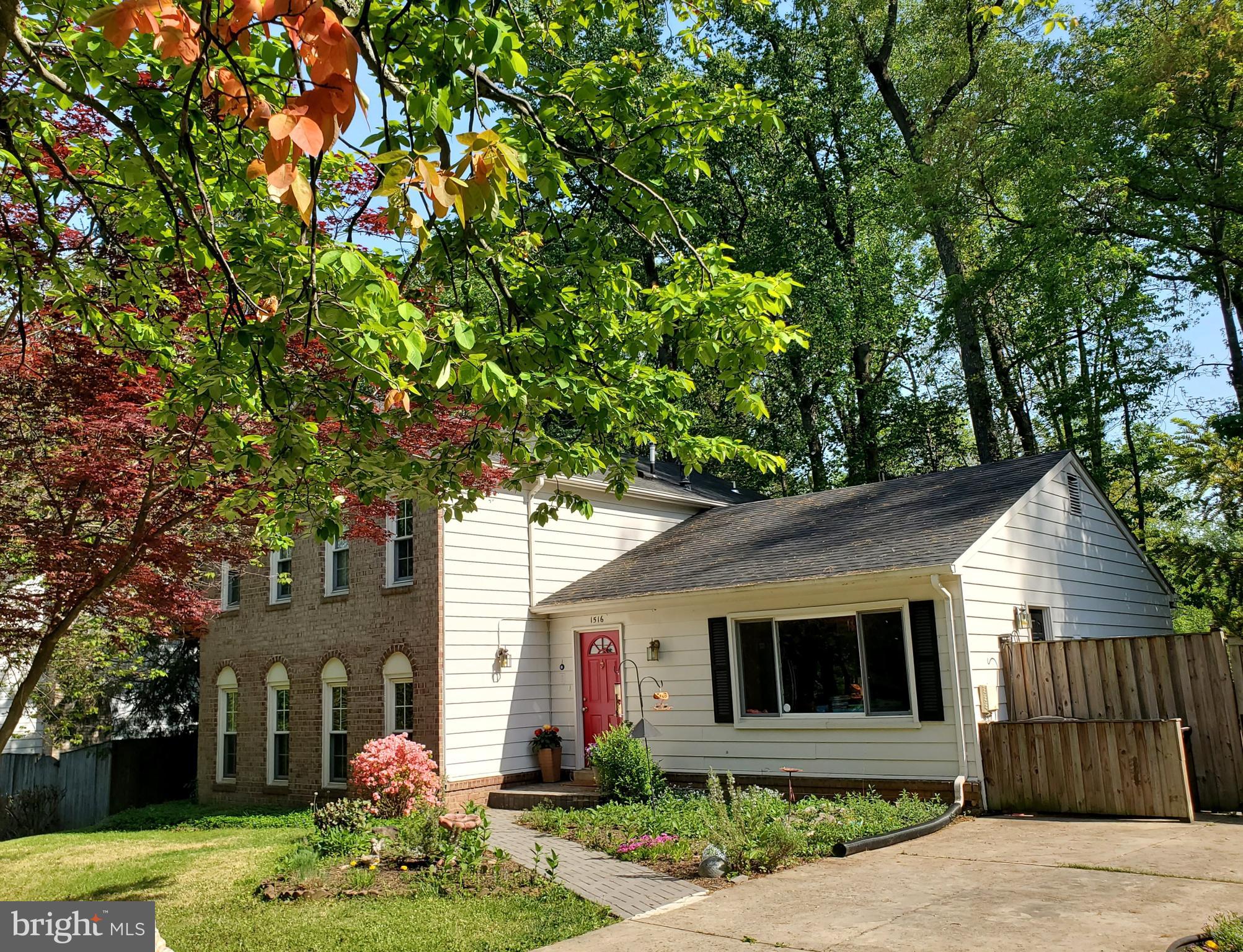 1516 Winding Waye Lane Silver Spring, MD 20902 - Photo 4 of 55 a front view of a house with a yard