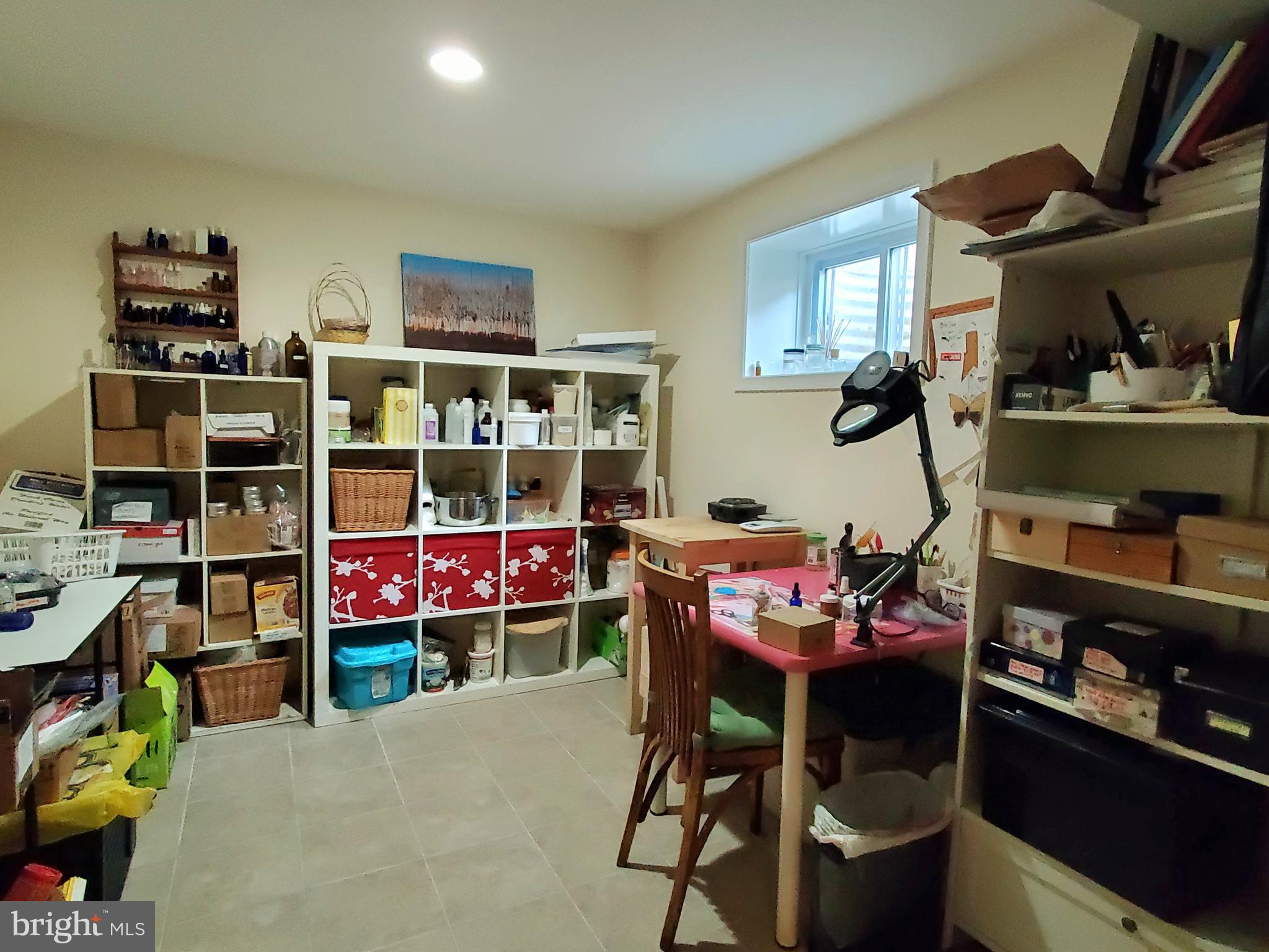 1516 Winding Waye Lane Silver Spring, MD 20902 - Photo 42 of 55 a room with furniture a rug and a bookshelf