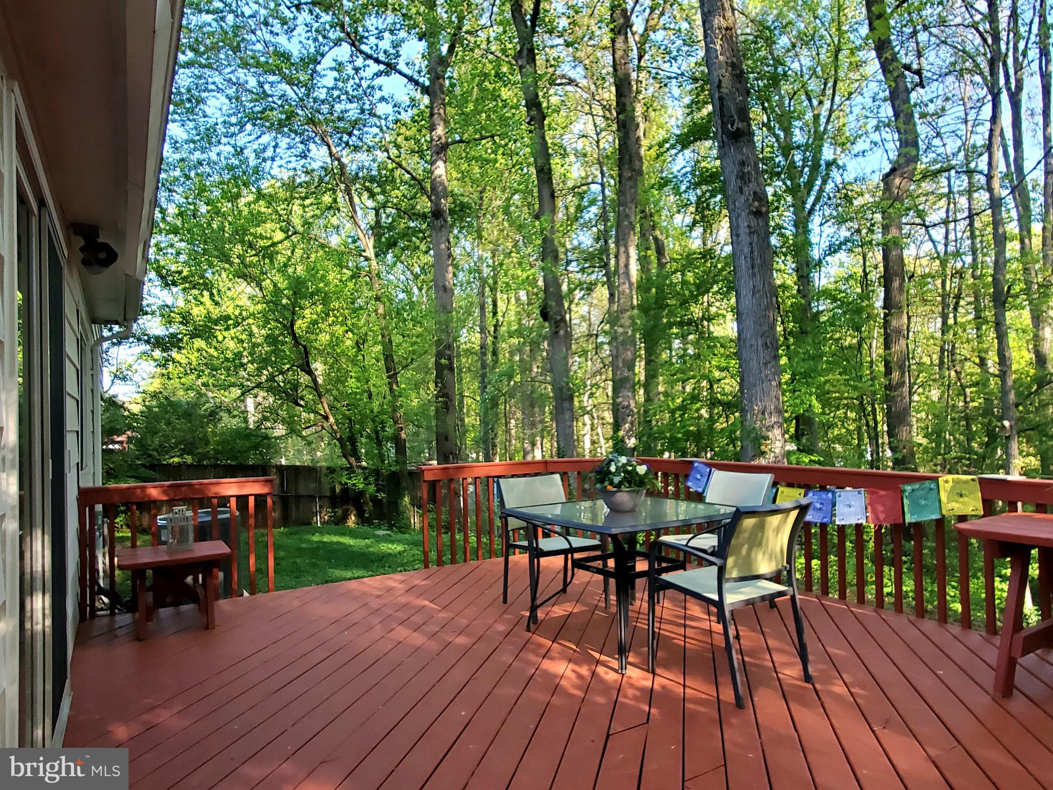 1516 Winding Waye Lane Silver Spring, MD 20902 - Photo 43 of 55 a view of a chairs and table on the wooden deck