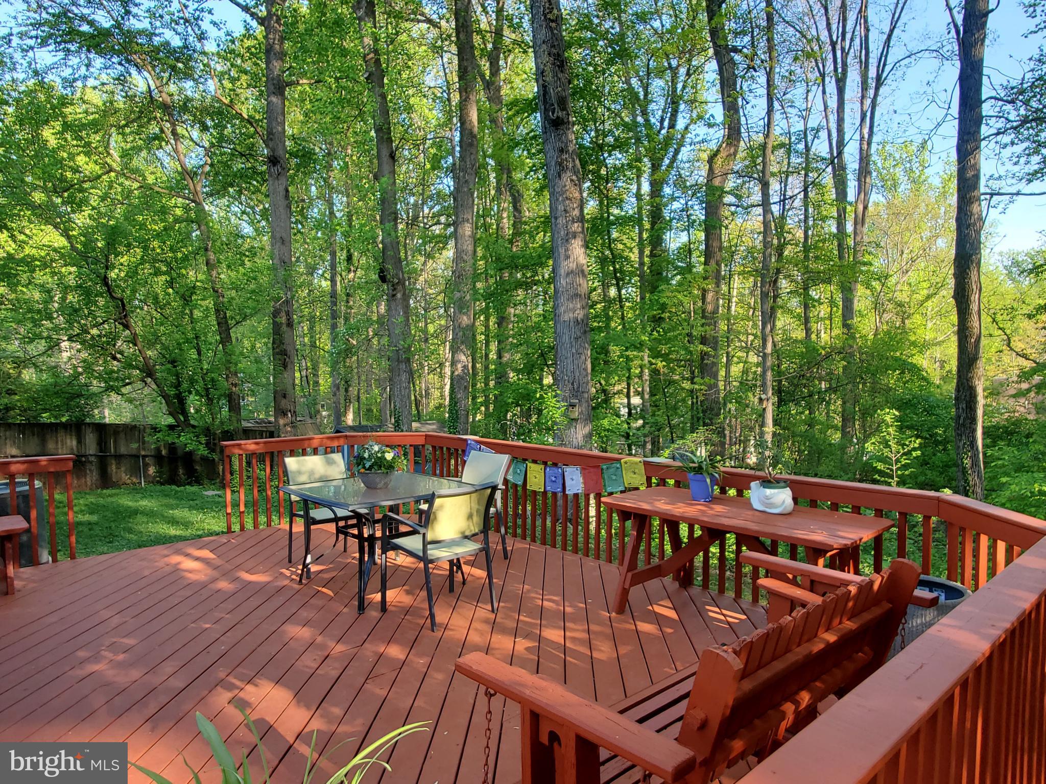 1516 Winding Waye Lane Silver Spring, MD 20902 - Photo 44 of 55 a view of a chairs and table on the wooden deck