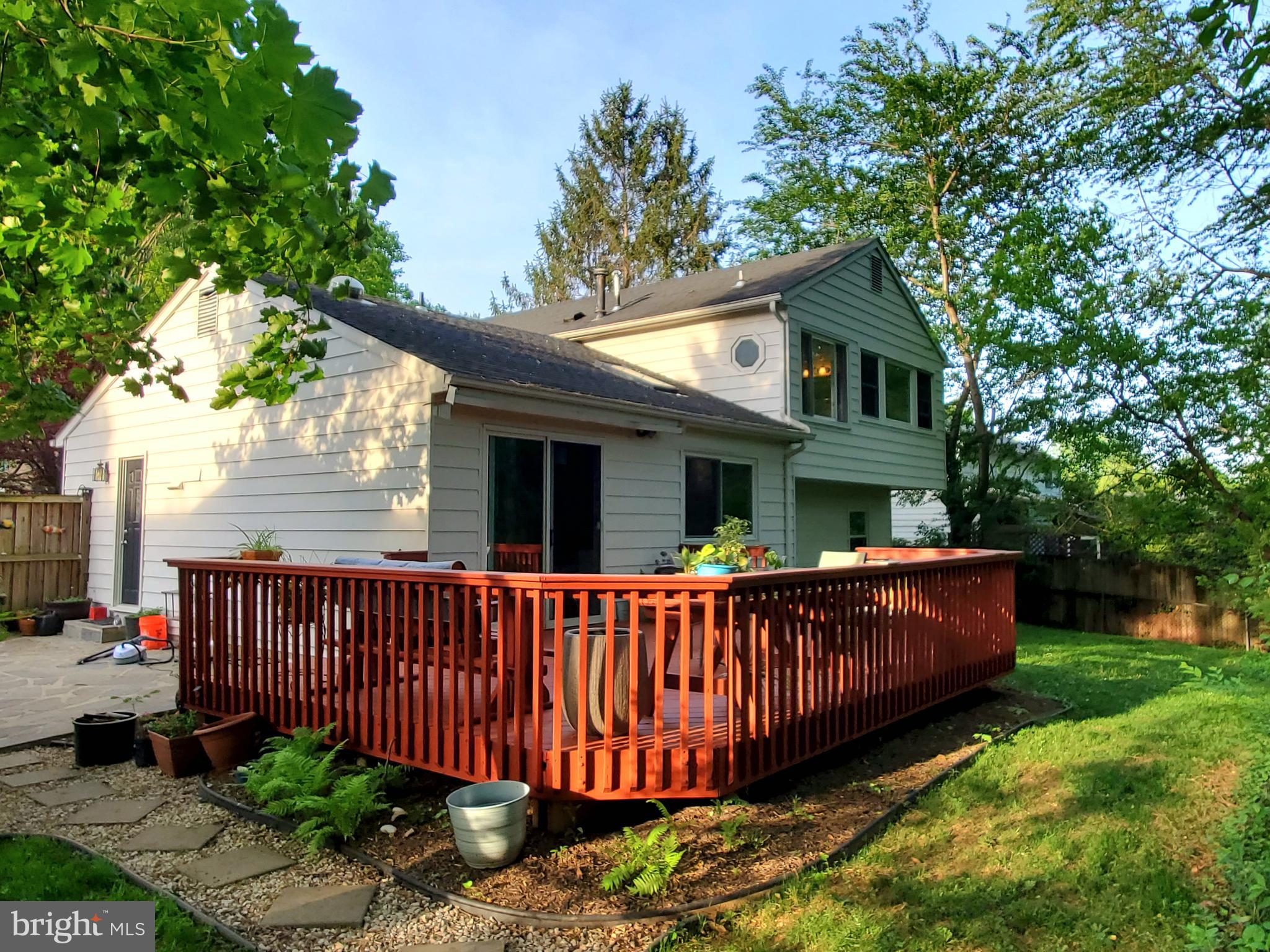 1516 Winding Waye Lane Silver Spring, MD 20902 - Photo 45 of 55 a view of a house with a wooden deck and a yard