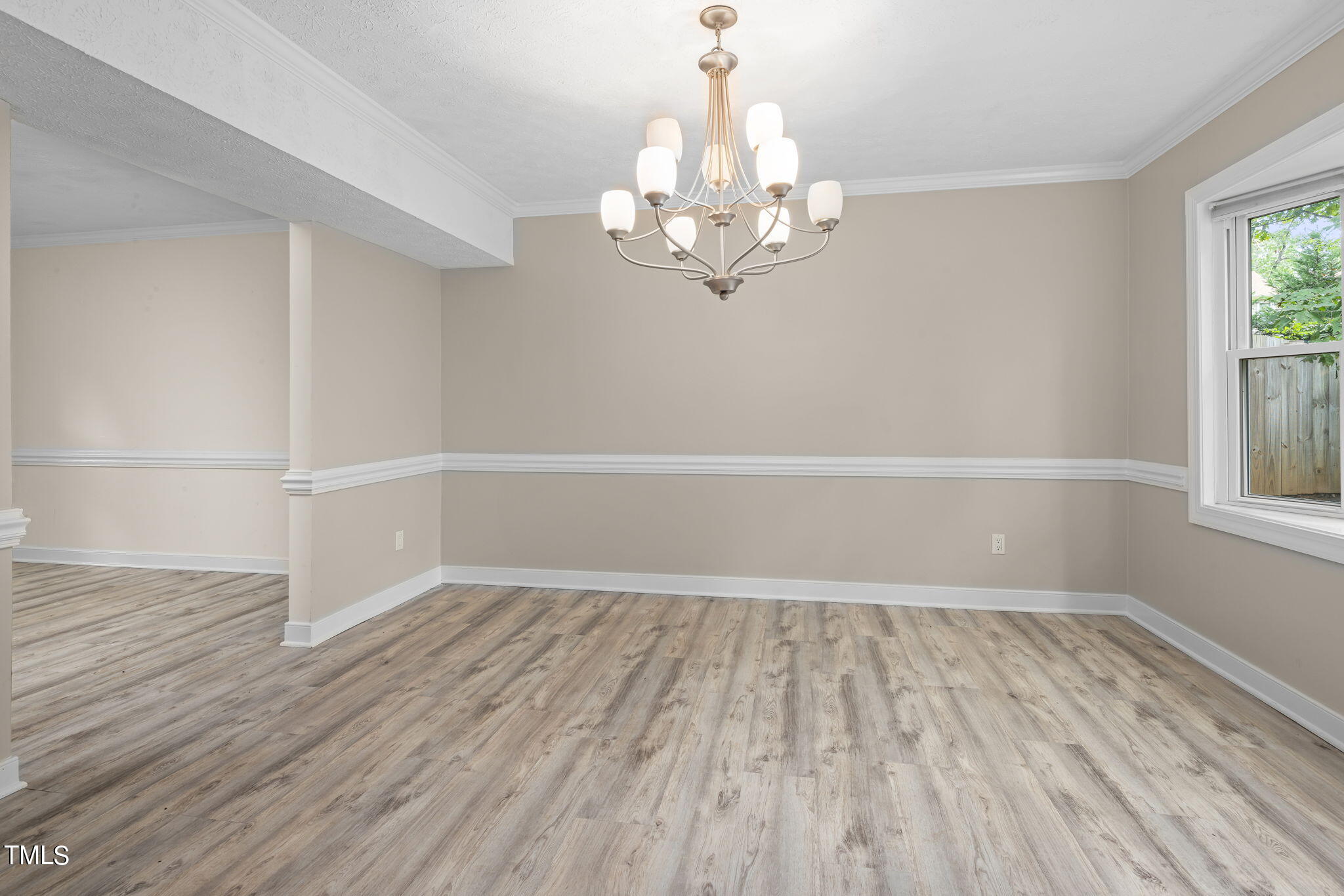 102 Old Bellows Court Raleigh, NC 27607 - Photo 11 of 36 wooden floor in an empty room with a window