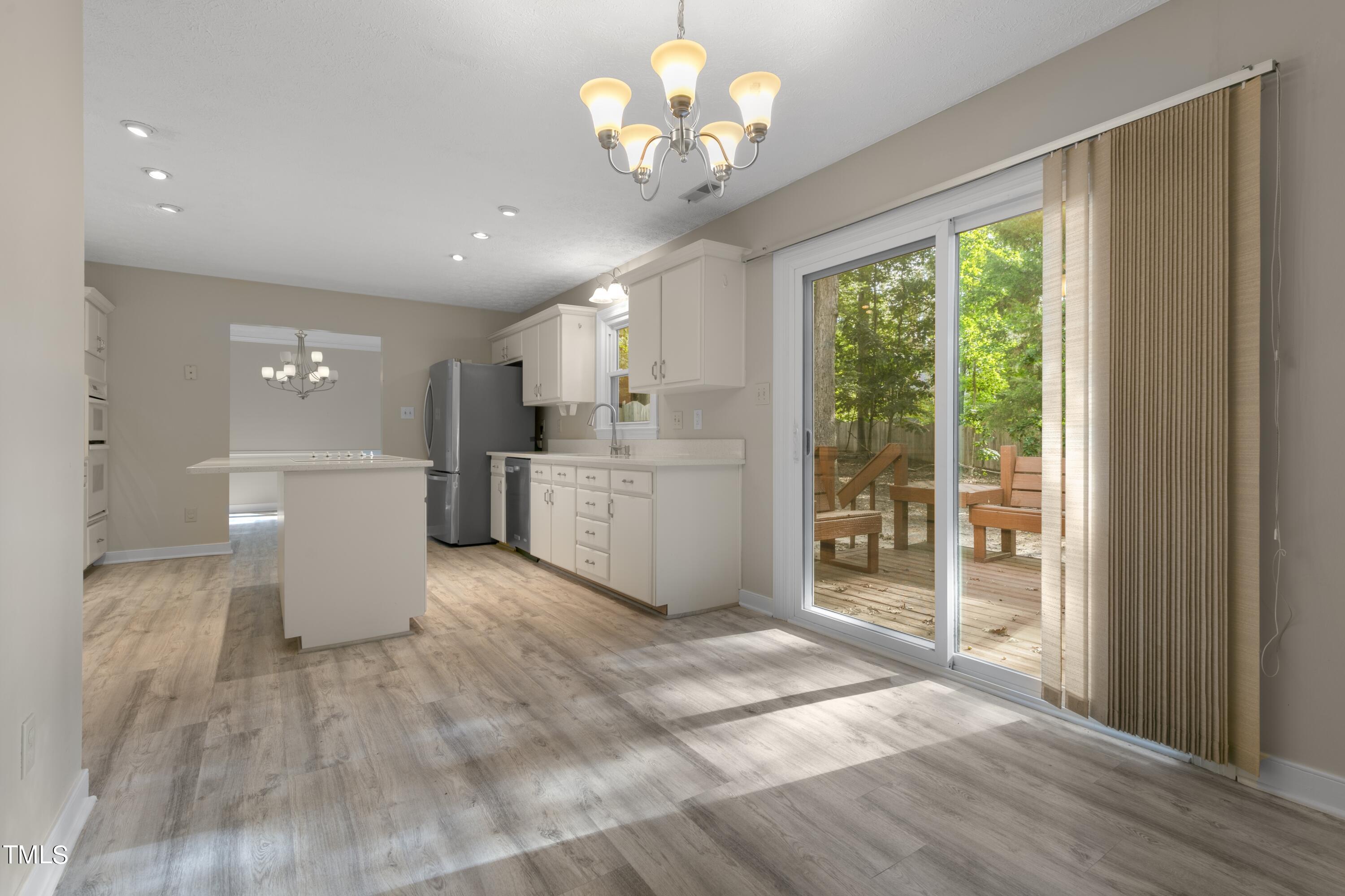 102 Old Bellows Court Raleigh, NC 27607 - Photo 13 of 36 a view of a kitchen with a sink and a window