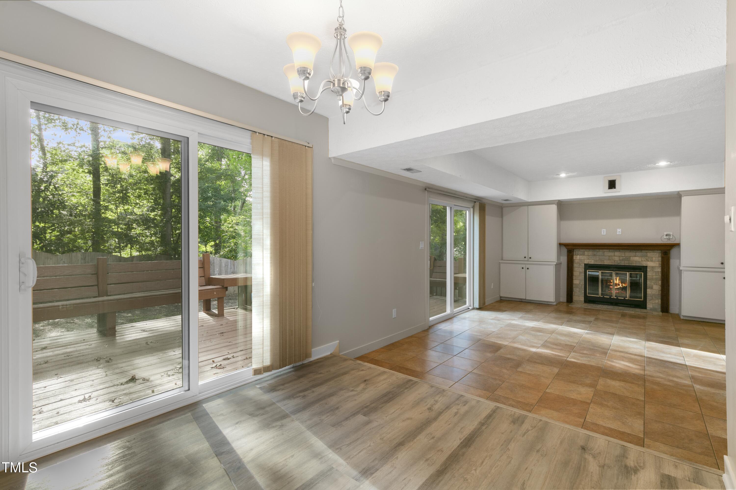 102 Old Bellows Court Raleigh, NC 27607 - Photo 15 of 36 a view of an empty room with a fireplace and a window