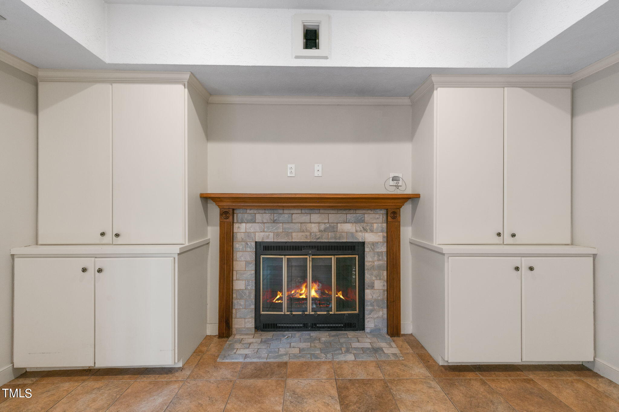 102 Old Bellows Court Raleigh, NC 27607 - Photo 18 of 36 a living room with a fireplace