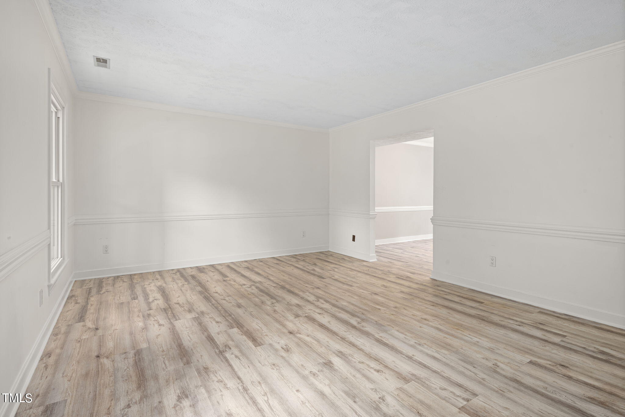 102 Old Bellows Court Raleigh, NC 27607 - Photo 5 of 36 a view of empty room with wooden floor