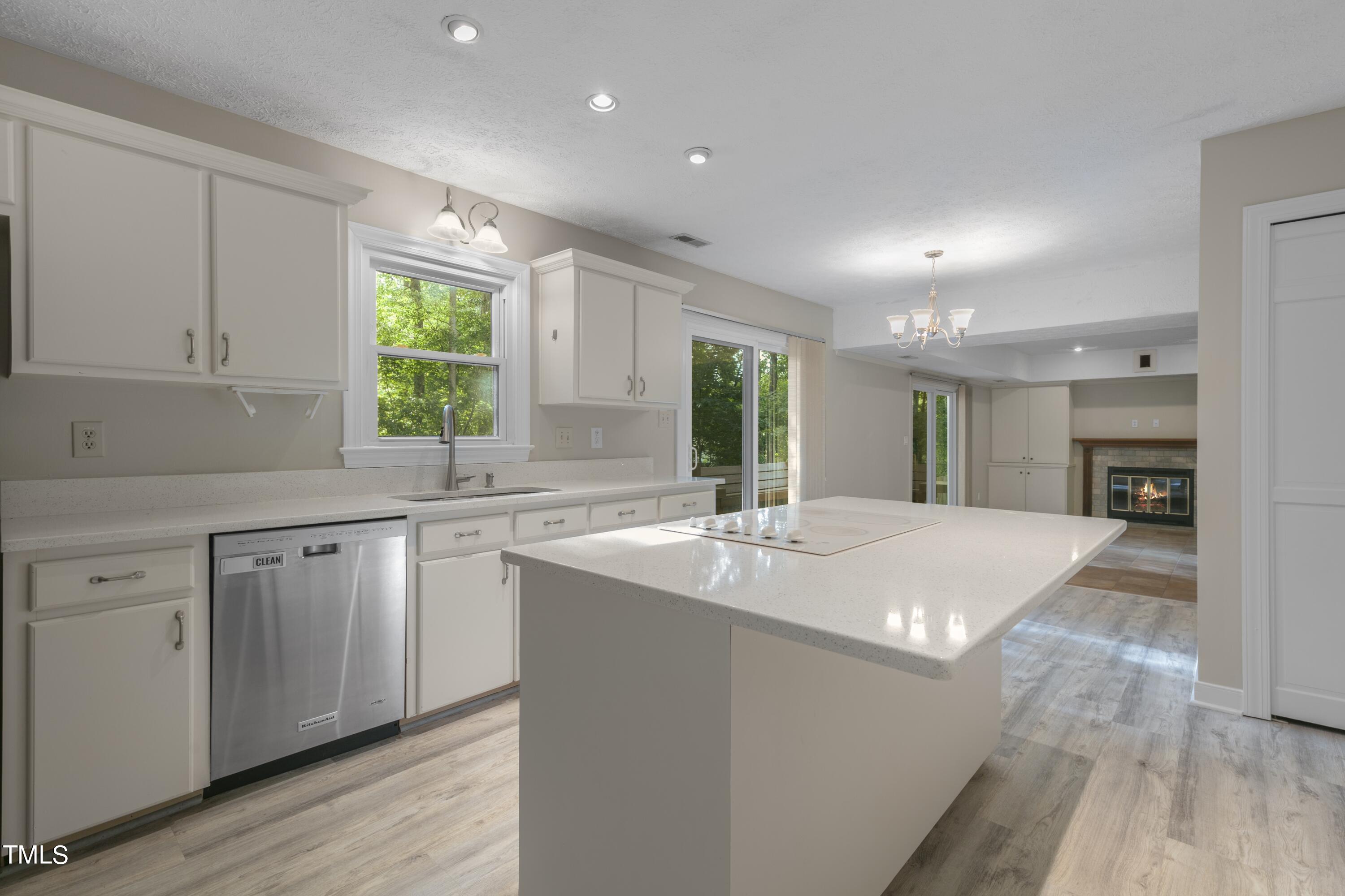 102 Old Bellows Court Raleigh, NC 27607 - Photo 10 of 36 a kitchen with sink refrigerator and window
