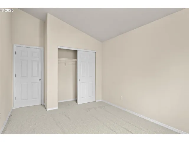 a balcony with wooden floor and fence