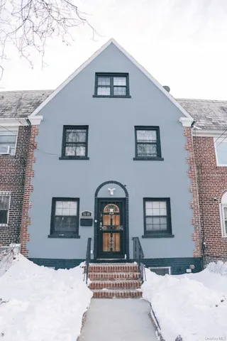 a view of a couches and table in front of house