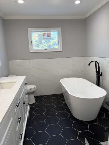 a bathroom with a double vanity sink and mirror
