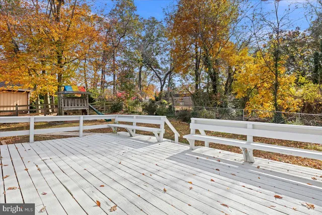 a view of outdoor space with deck and a garden