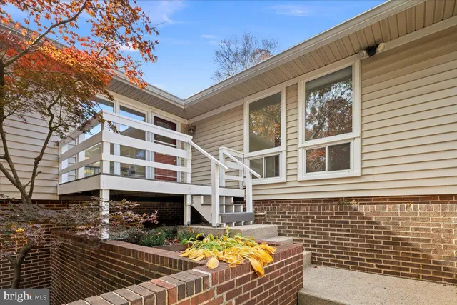 a front view of a house with large windows