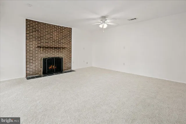 en empty room with large windows