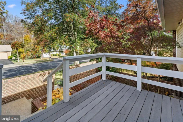 a view of deck with two chairs and a table