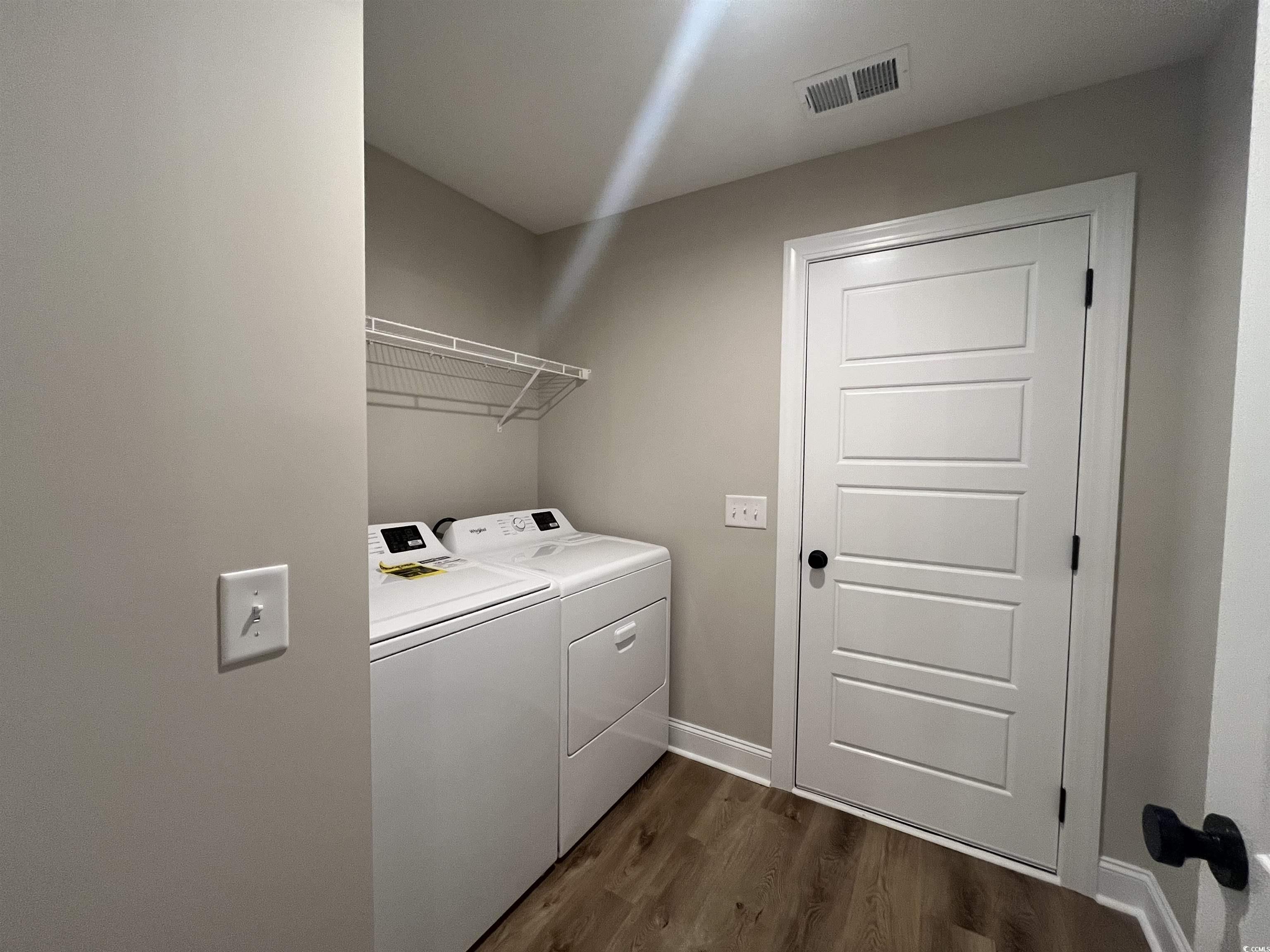 2584 Moores Mill Road Aynor, SC 29511 - Photo 14 of 14 Laundry area featuring dark wood-type flooring and washer and clothes dryer