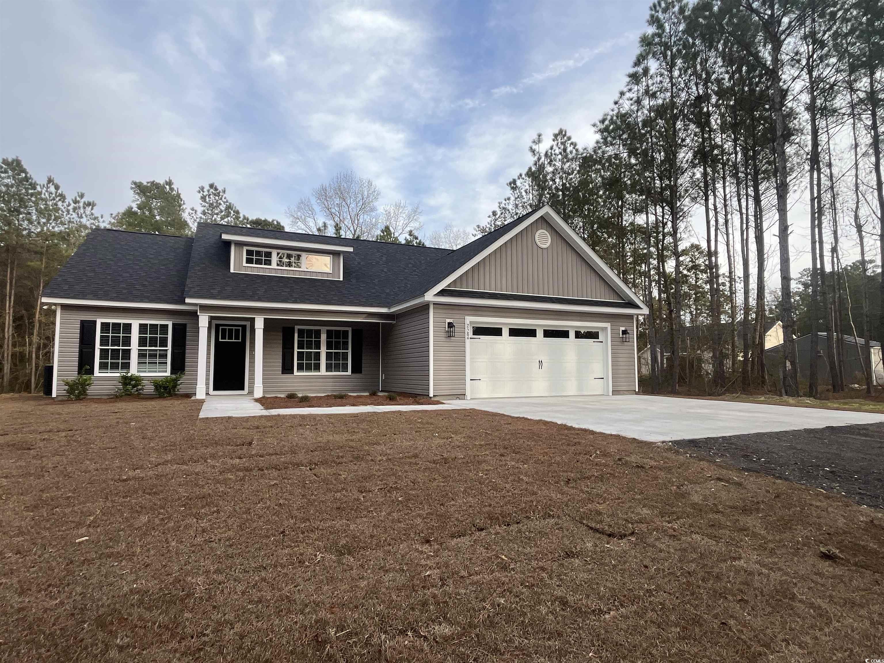 2584 Moores Mill Road Aynor, SC 29511 - Photo 2 of 14 View of front of property featuring a porch, driveway, roof with shingles, and a garage