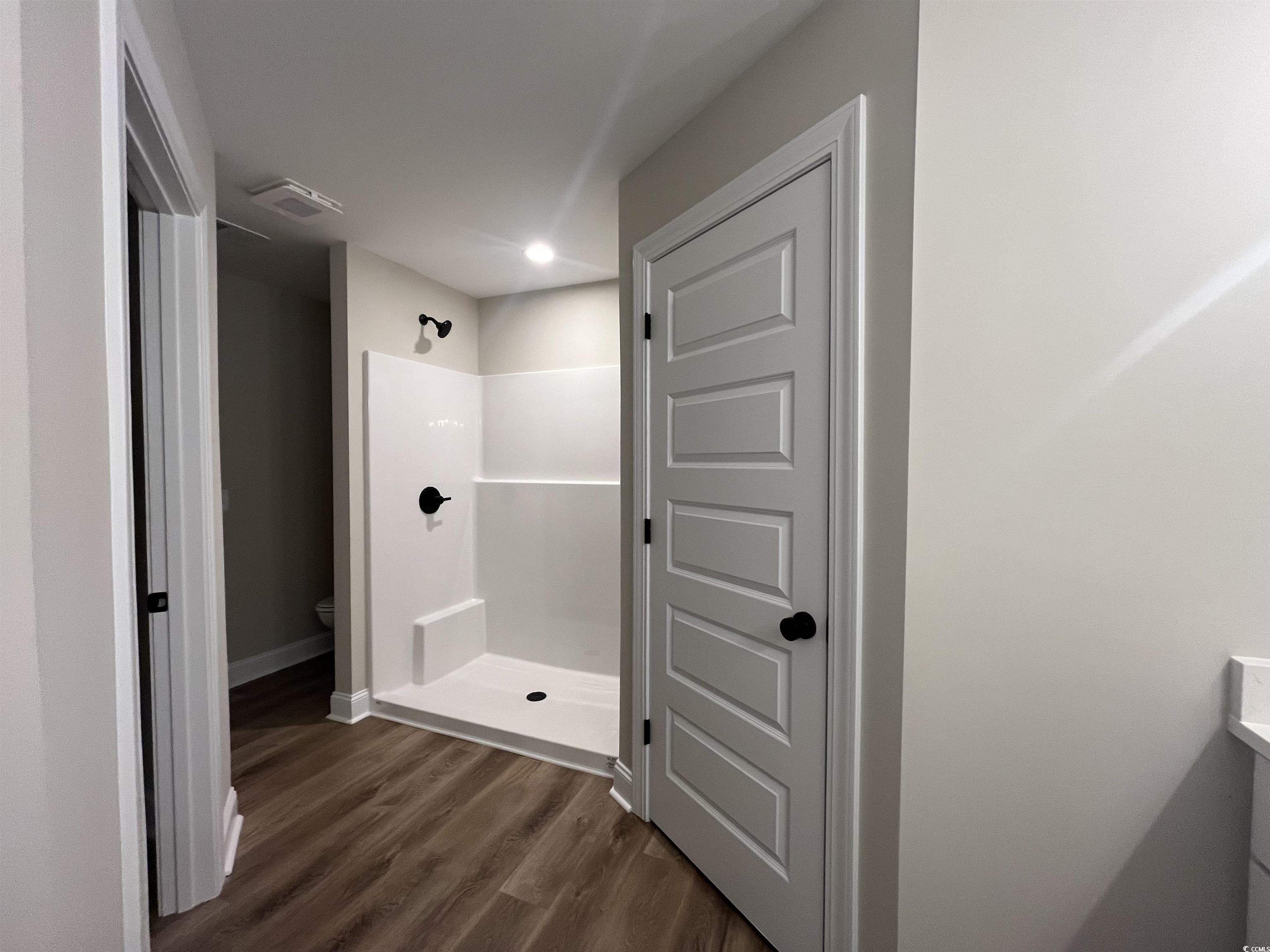 2584 Moores Mill Road Aynor, SC 29511 - Photo 10 of 14 Full bath featuring a stall shower, dark wood-style floors, and recessed lighting