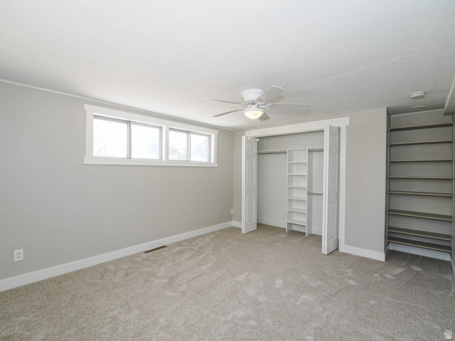 154 East 3000th Street South Bountiful, UT 84010 - Photo 15 of 37 Neutral-toned carpeting and walls complement the white trim and ceiling